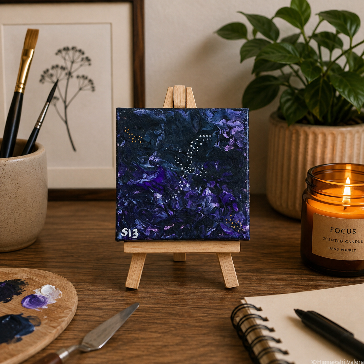 Afterglow, an original warm-toned mini soundwave canvas on a small wooden stand, displayed on a shelf