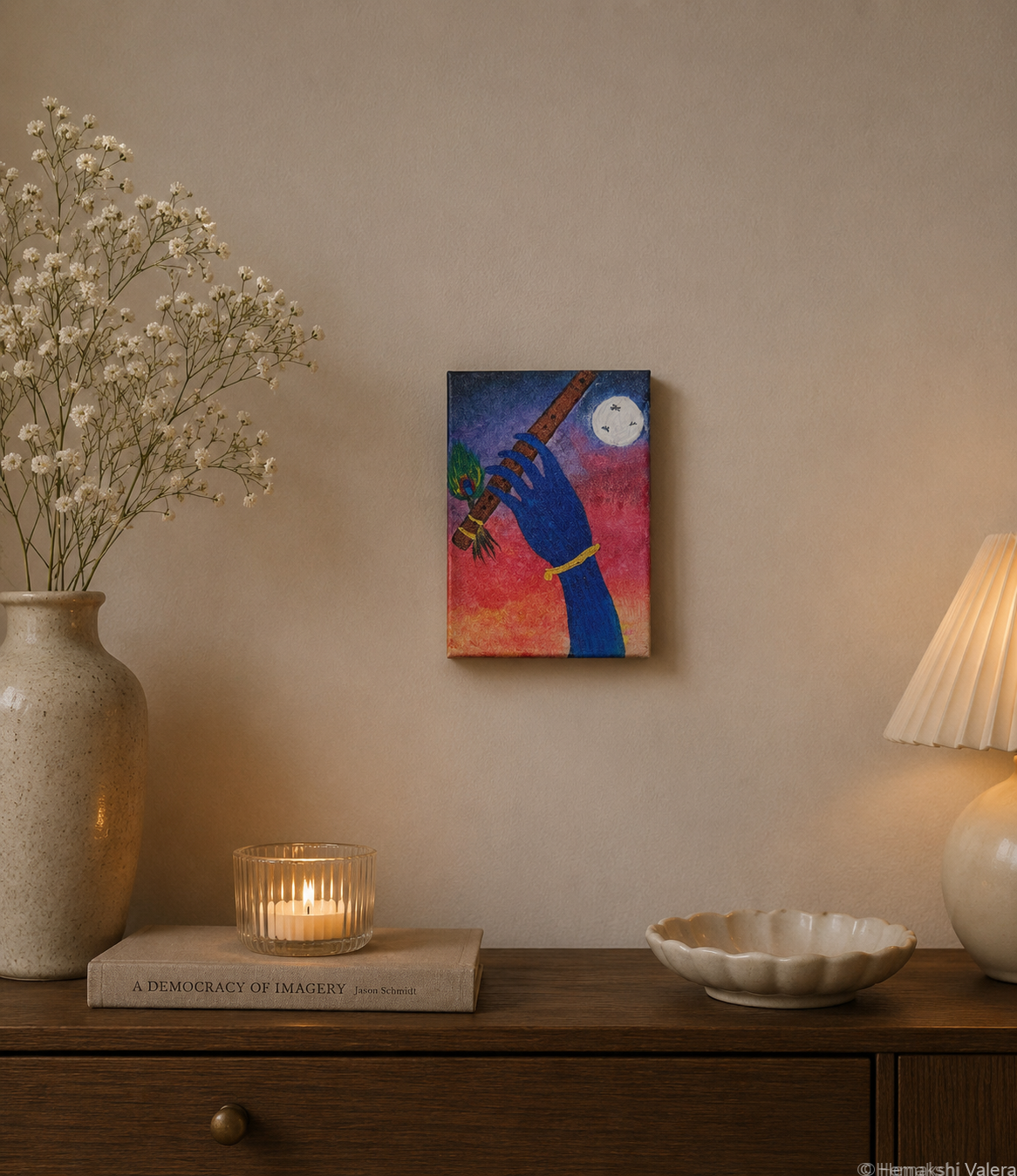The Call of Vrindavan, an original Krishna painting in pink and purple tones, hanging in a warm-toned interior