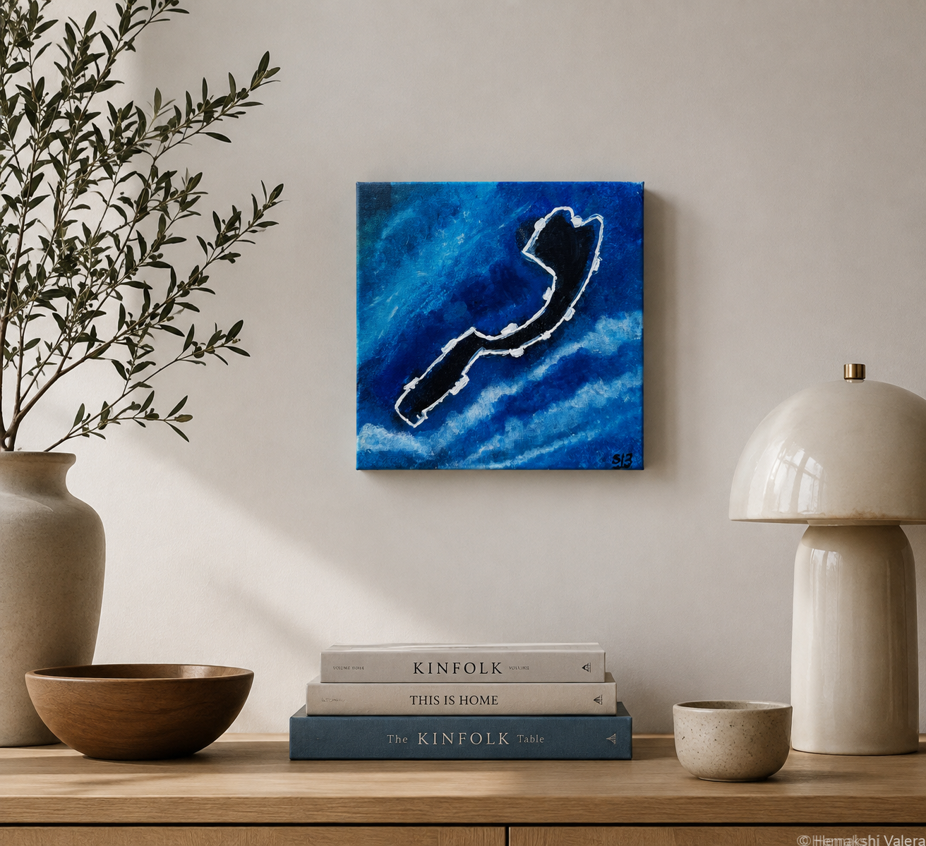 Tides of Monaco, an original ocean blue F1 circuit painting, hanging above a console in a coastal-toned room