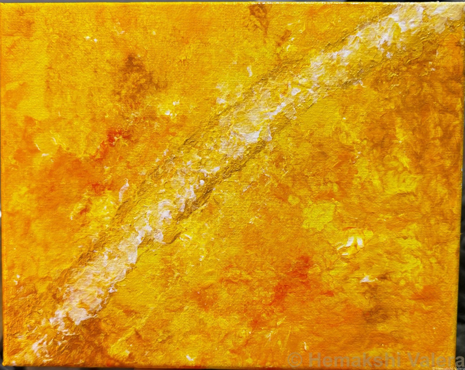Abstract acrylic painting in golden yellow, amber and white with a diagonal seam of light, by Australian artist Hemakshi Valera