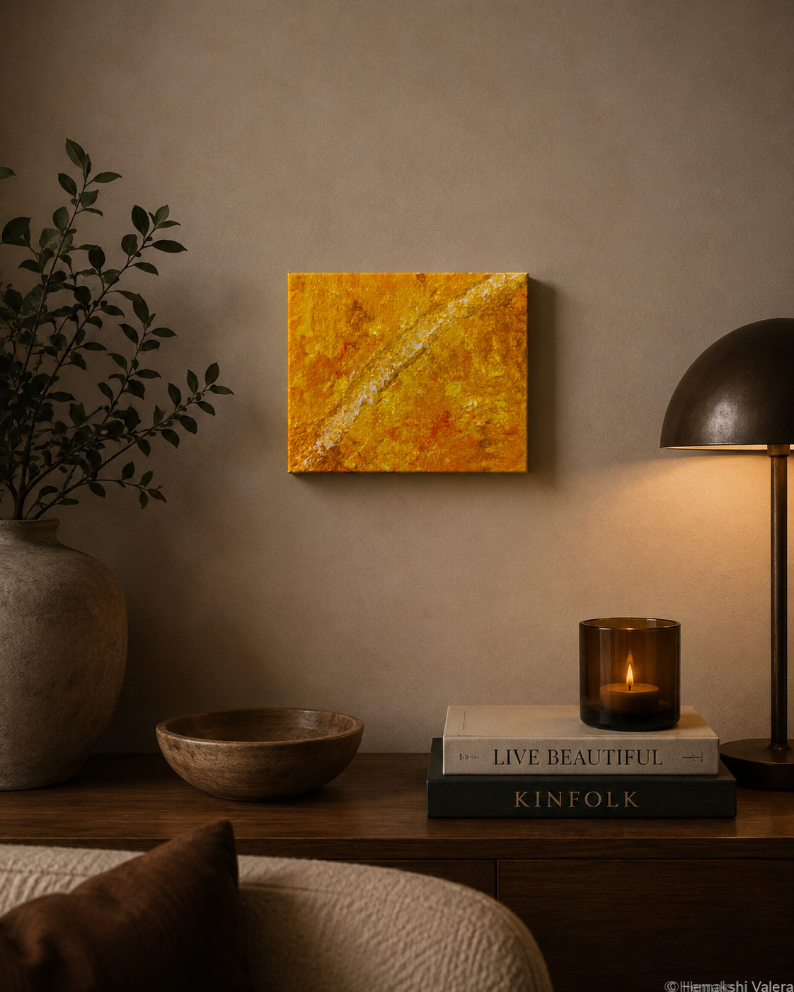 Held in Light, an original golden amber and white abstract painting, hanging in a sunlit living room