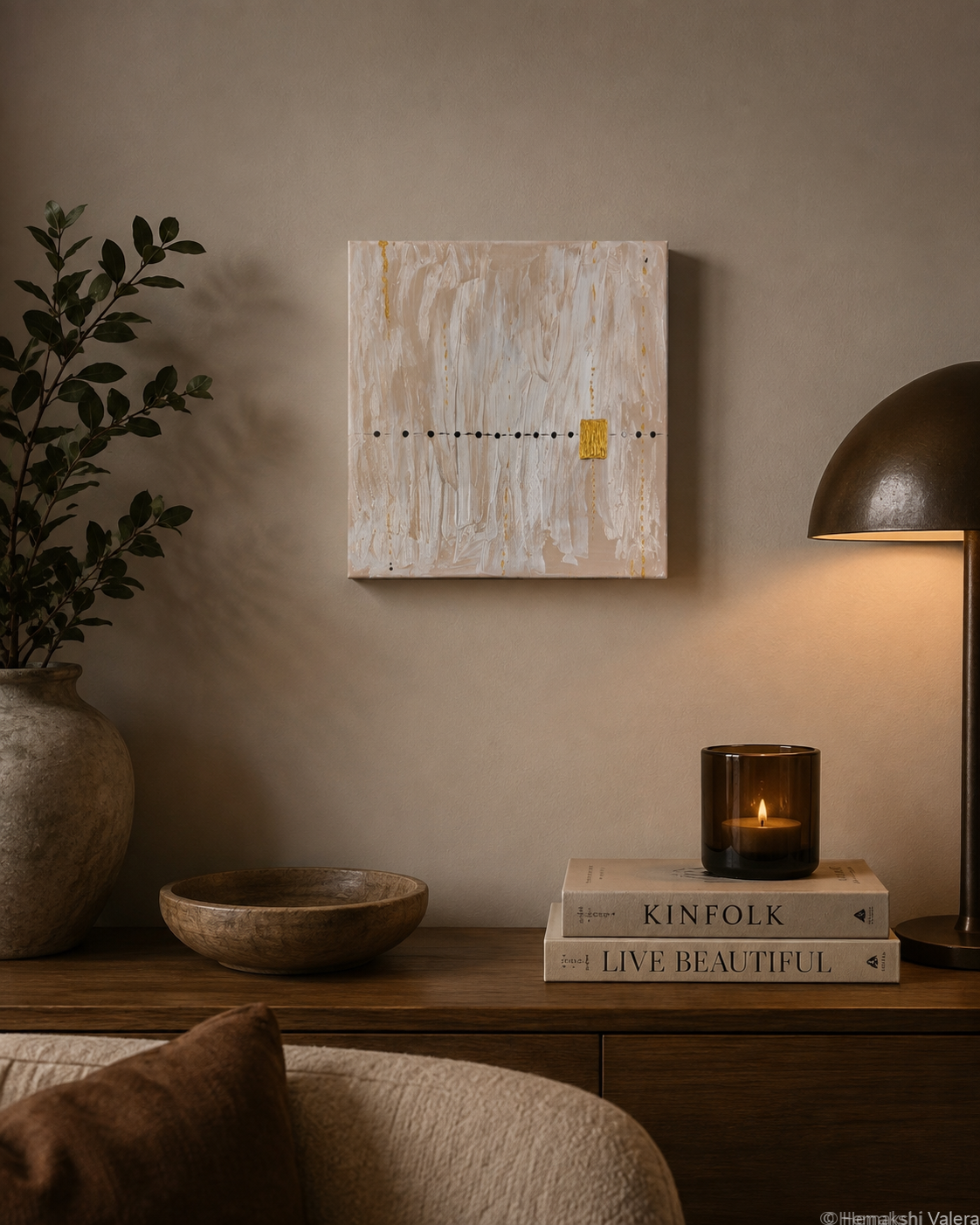 The First Note, an original white and gold abstract painting, hanging above a bed in a soft neutral bedroom