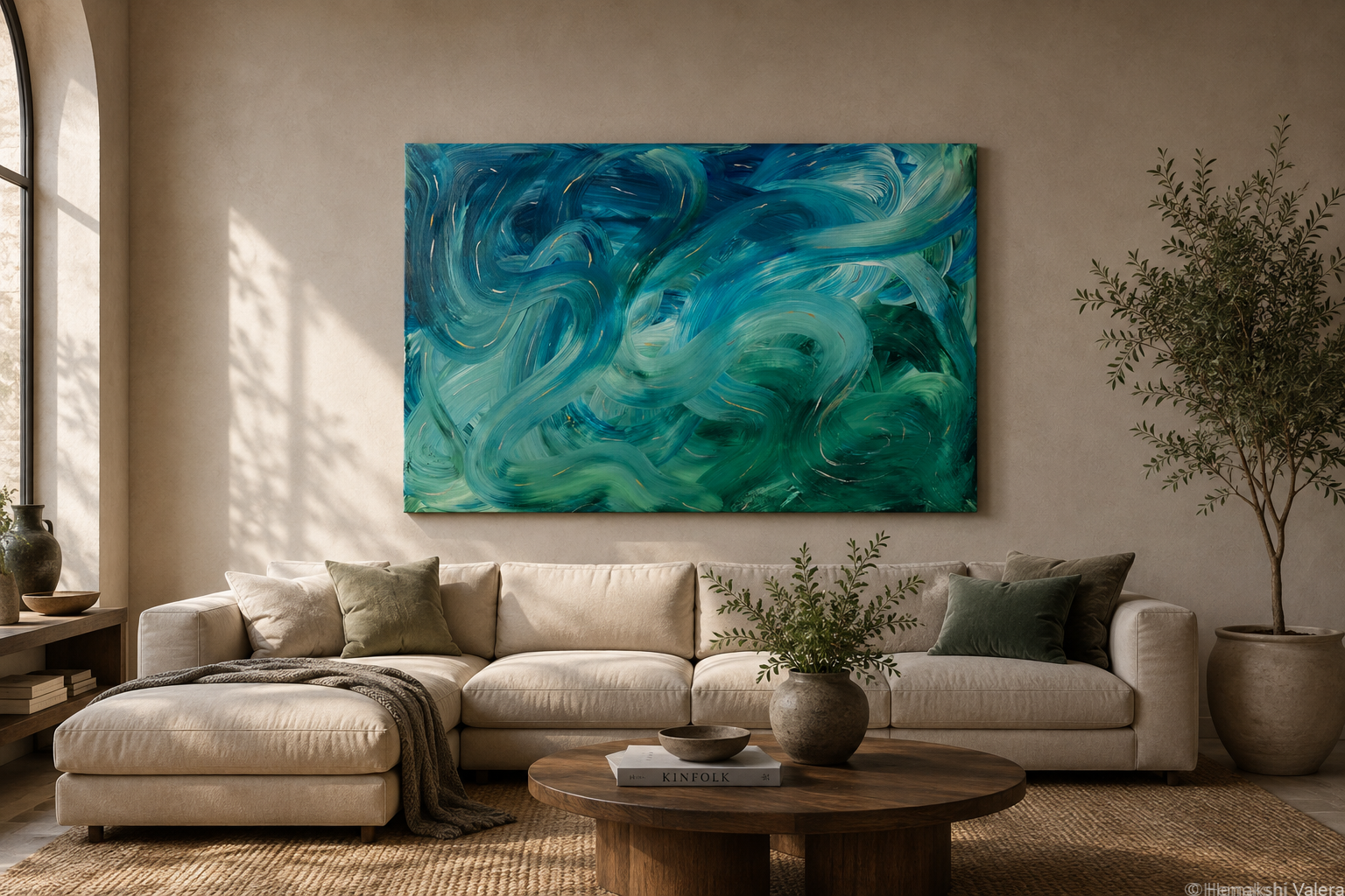 When Stillness Moves, a large original teal and emerald abstract painting, hanging above a sofa in a light-filled room