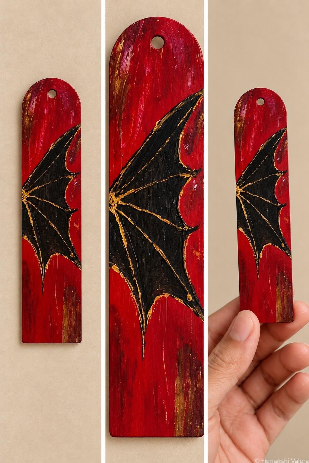 Crimson Wing red bookmark with a black dragon wing and gold painted details